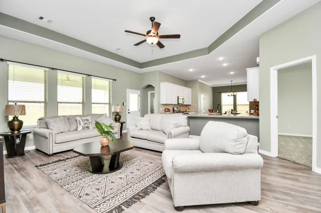 a living room with furniture or couches and a large window