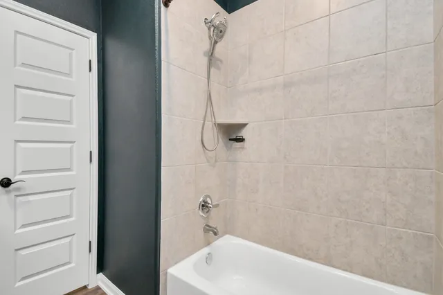 a view of a small space with wooden floor