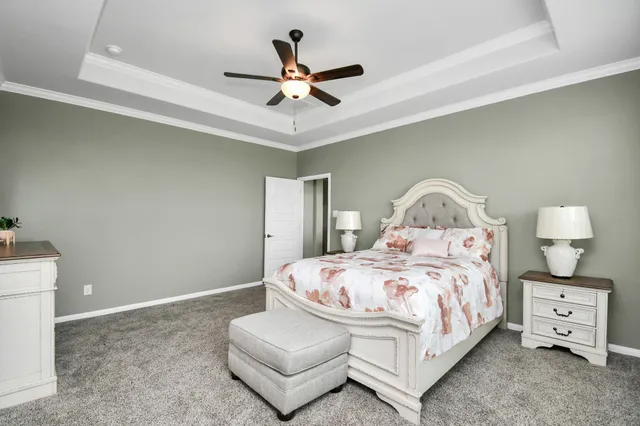 a bathroom with a granite countertop sink mirror and a bathtub