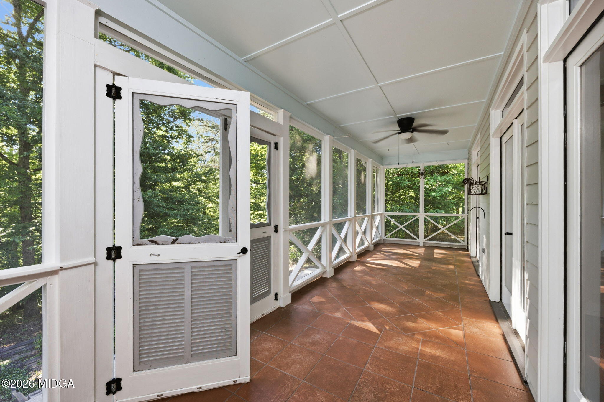 4686 Johnstonville Road Forsyth, GA 31029 - Photo 6 of 34 a view of a porch with wooden floor and windows