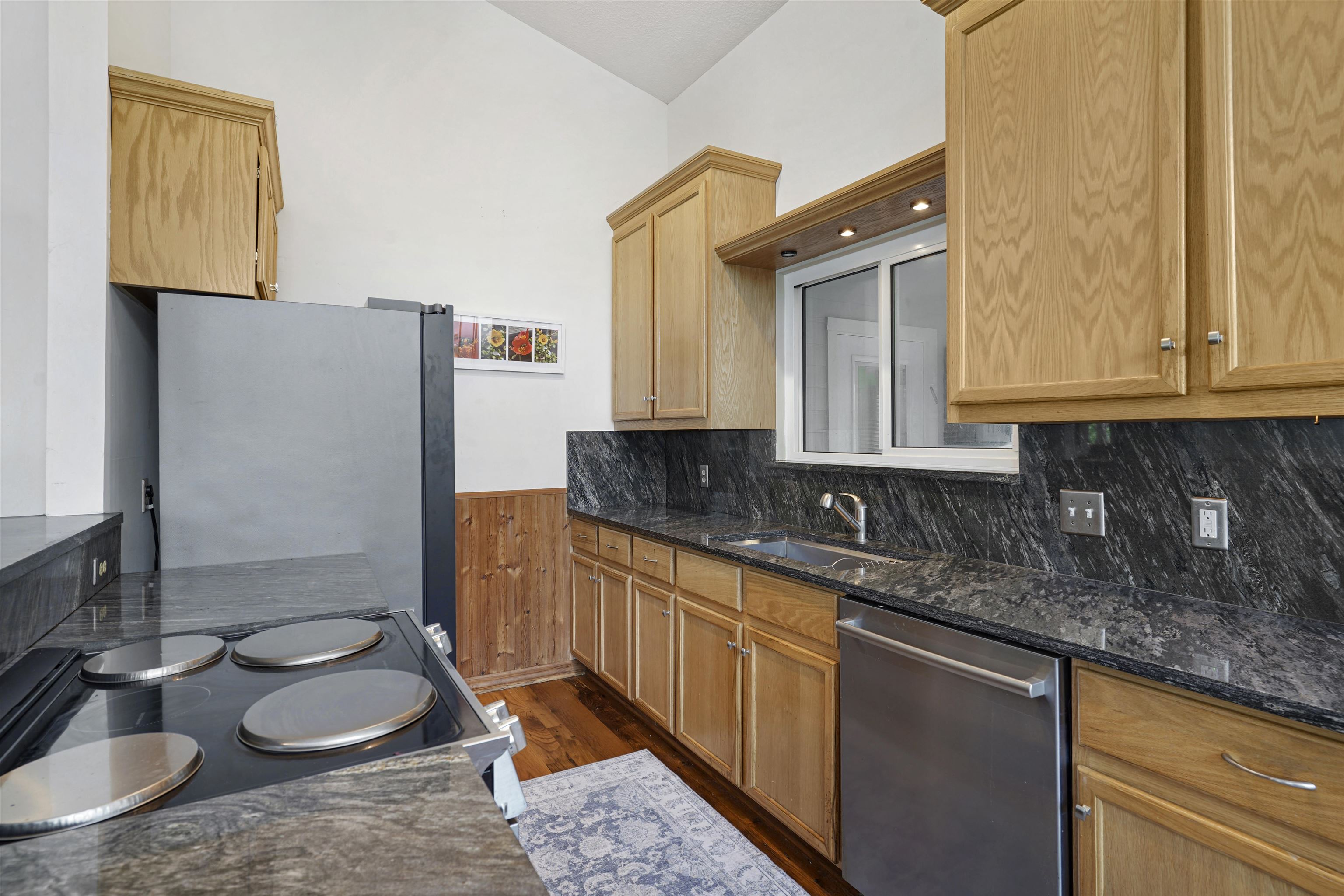 415 Fifteenth Street St. Augustine, FL 32084 - Photo 13 of 41 a kitchen with a sink and a stove top oven