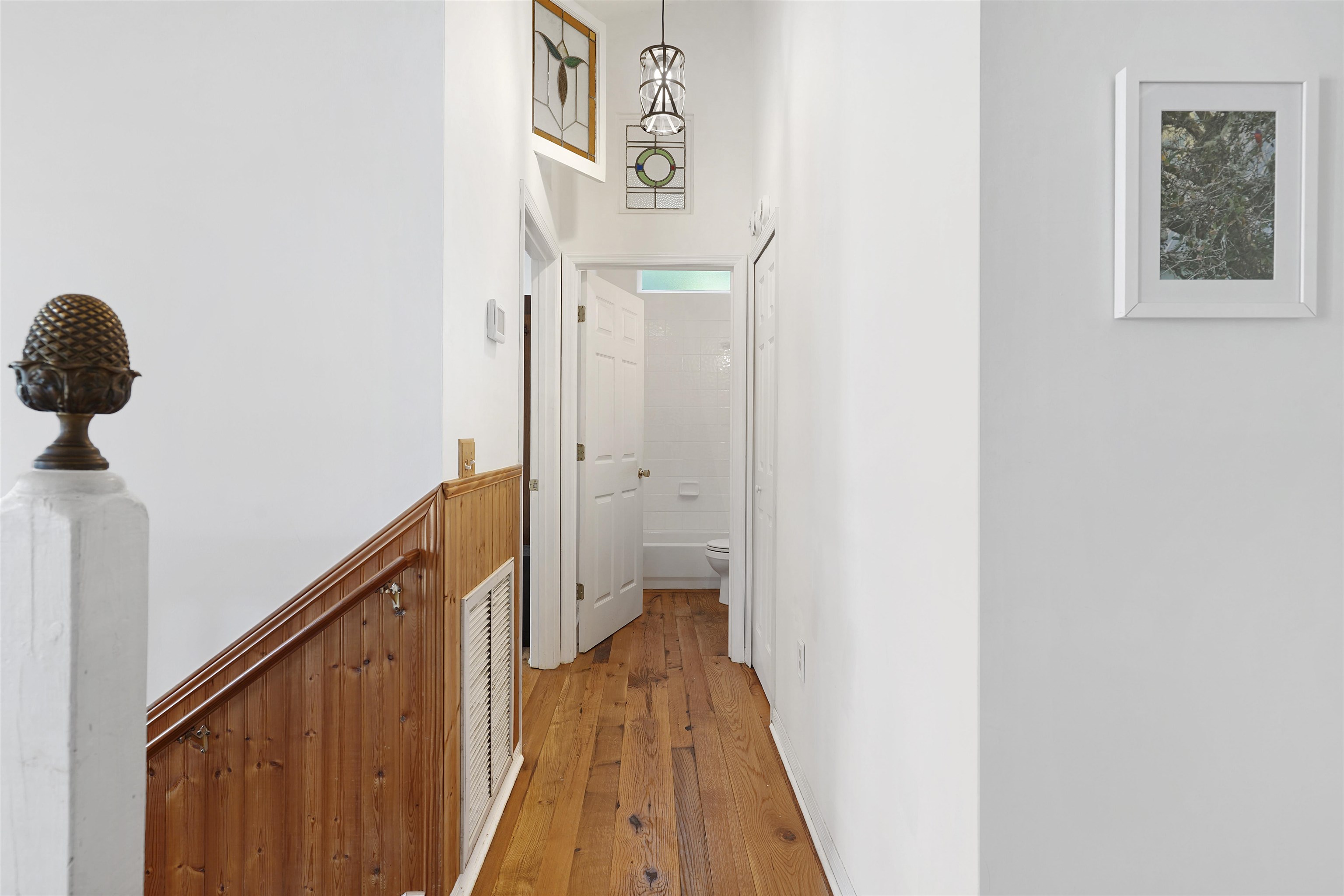 415 Fifteenth Street St. Augustine, FL 32084 - Photo 14 of 41 a view of a hallway with wooden floor and stairs