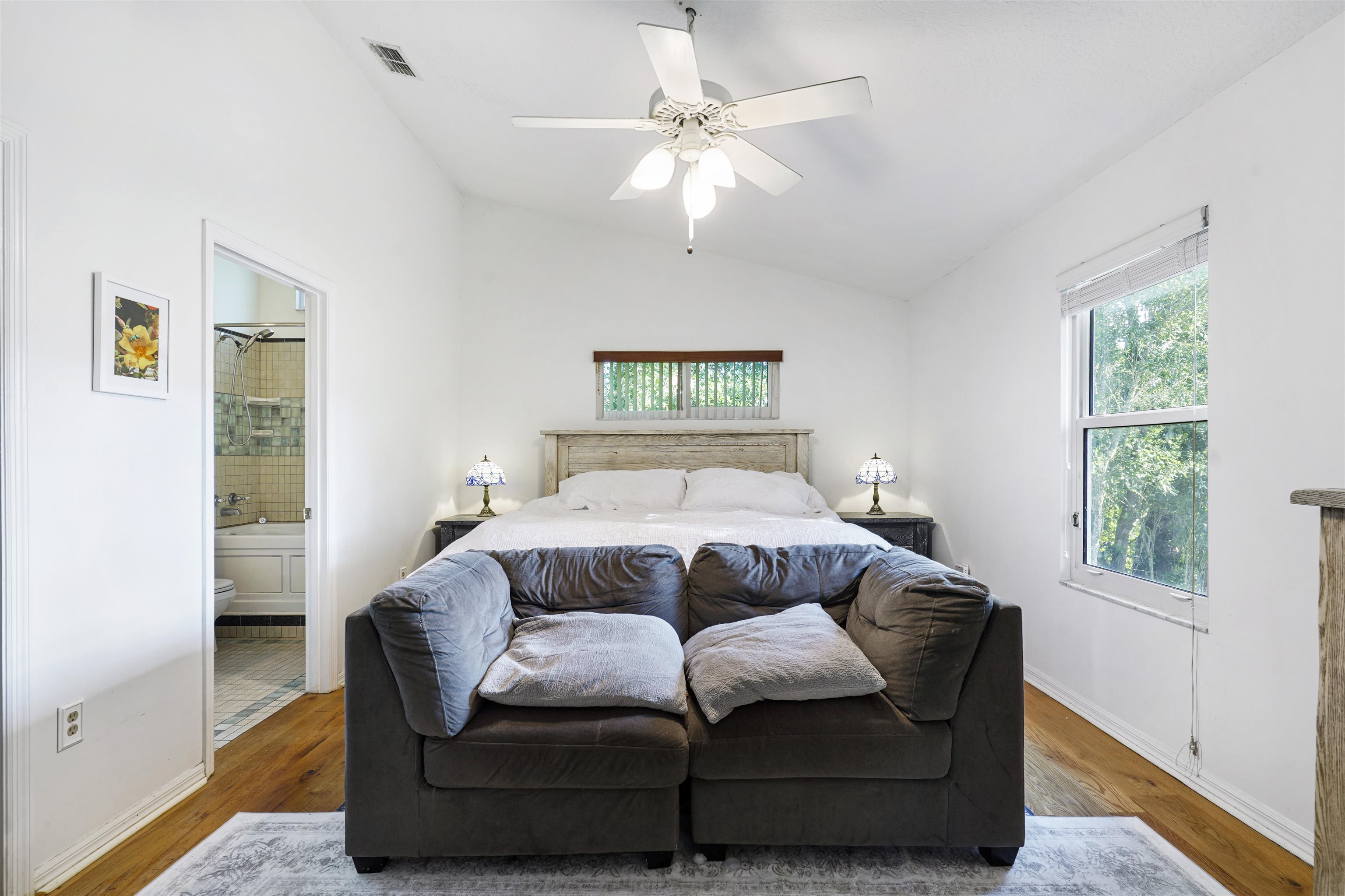 415 Fifteenth Street St. Augustine, FL 32084 - Photo 16 of 41 a bedroom with a bed couch and window