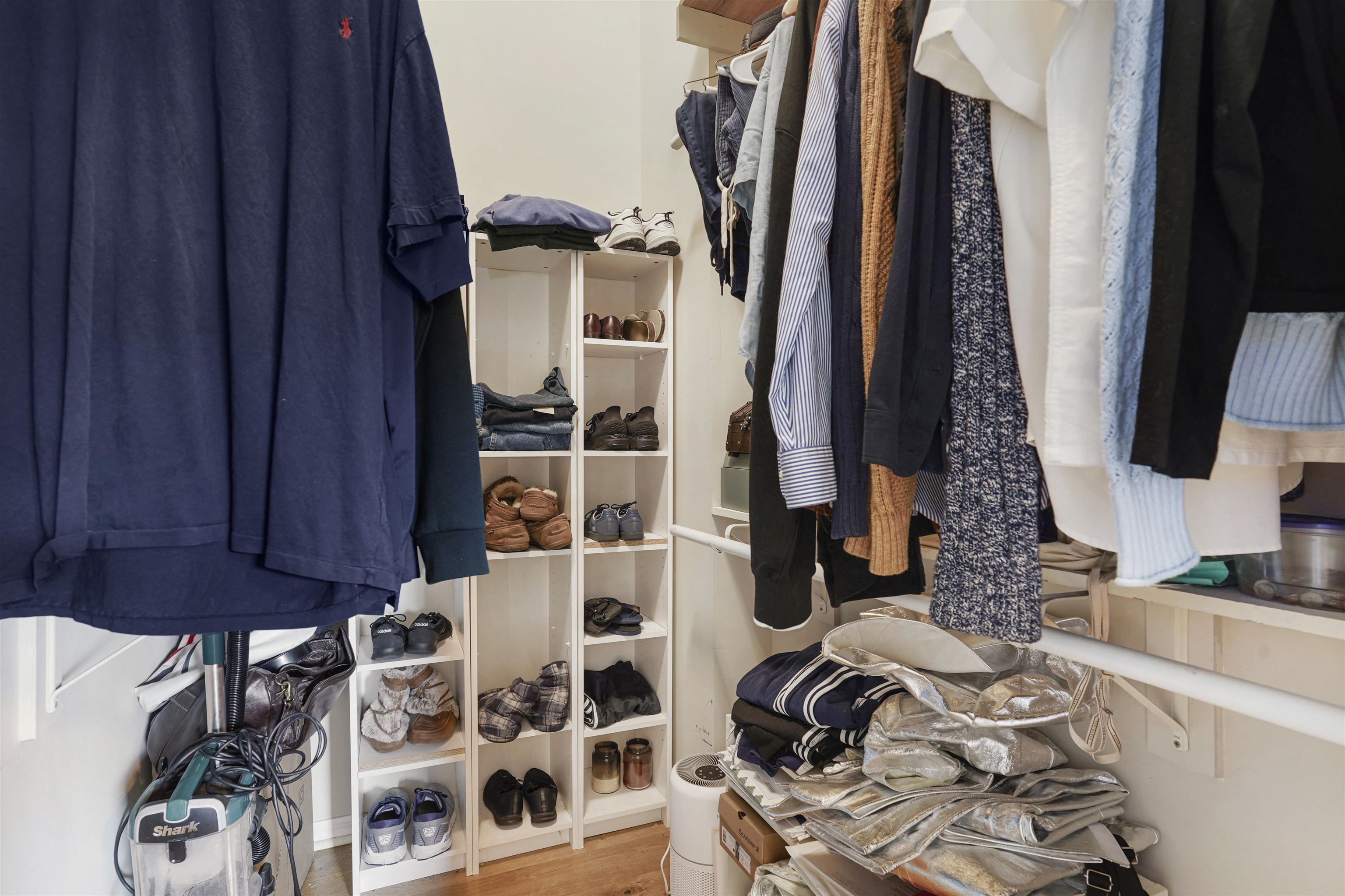 415 Fifteenth Street St. Augustine, FL 32084 - Photo 20 of 41 a view of walk in closet with clothes and shoes