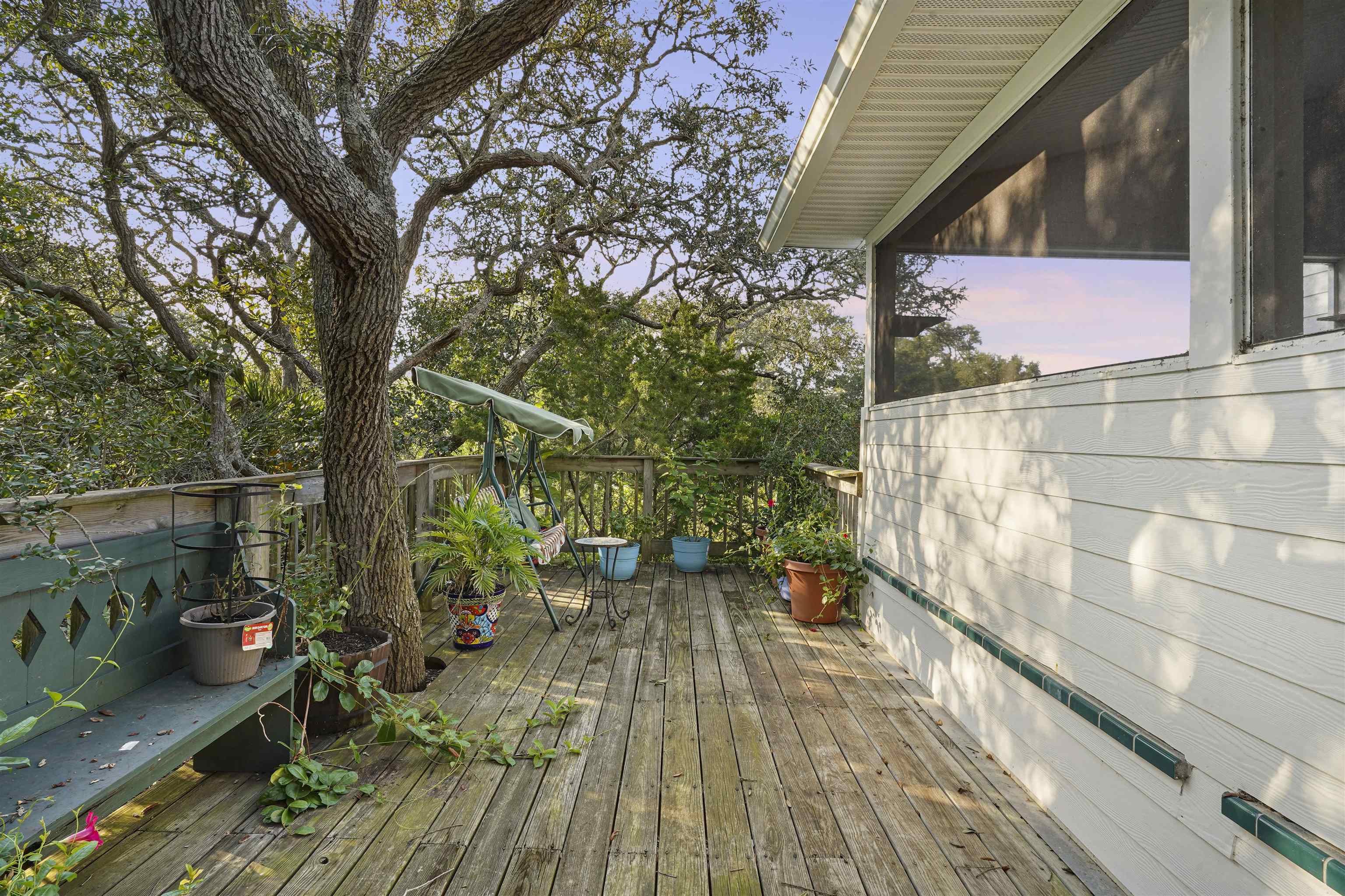 415 Fifteenth Street St. Augustine, FL 32084 - Photo 26 of 41 a view of balcony with wooden floor and outdoor seating