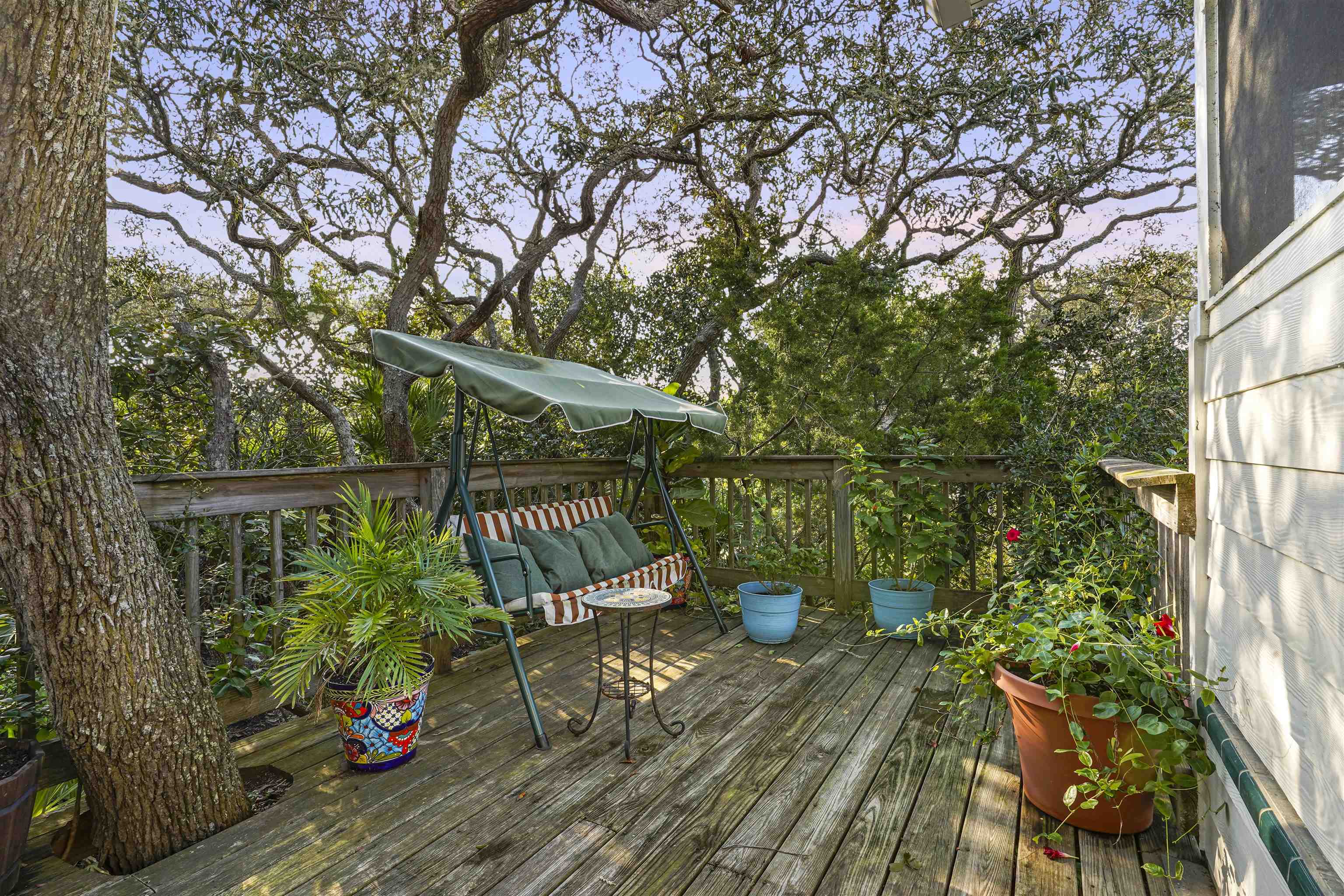 415 Fifteenth Street St. Augustine, FL 32084 - Photo 27 of 41 a view of balcony with wooden floor and outdoor seating