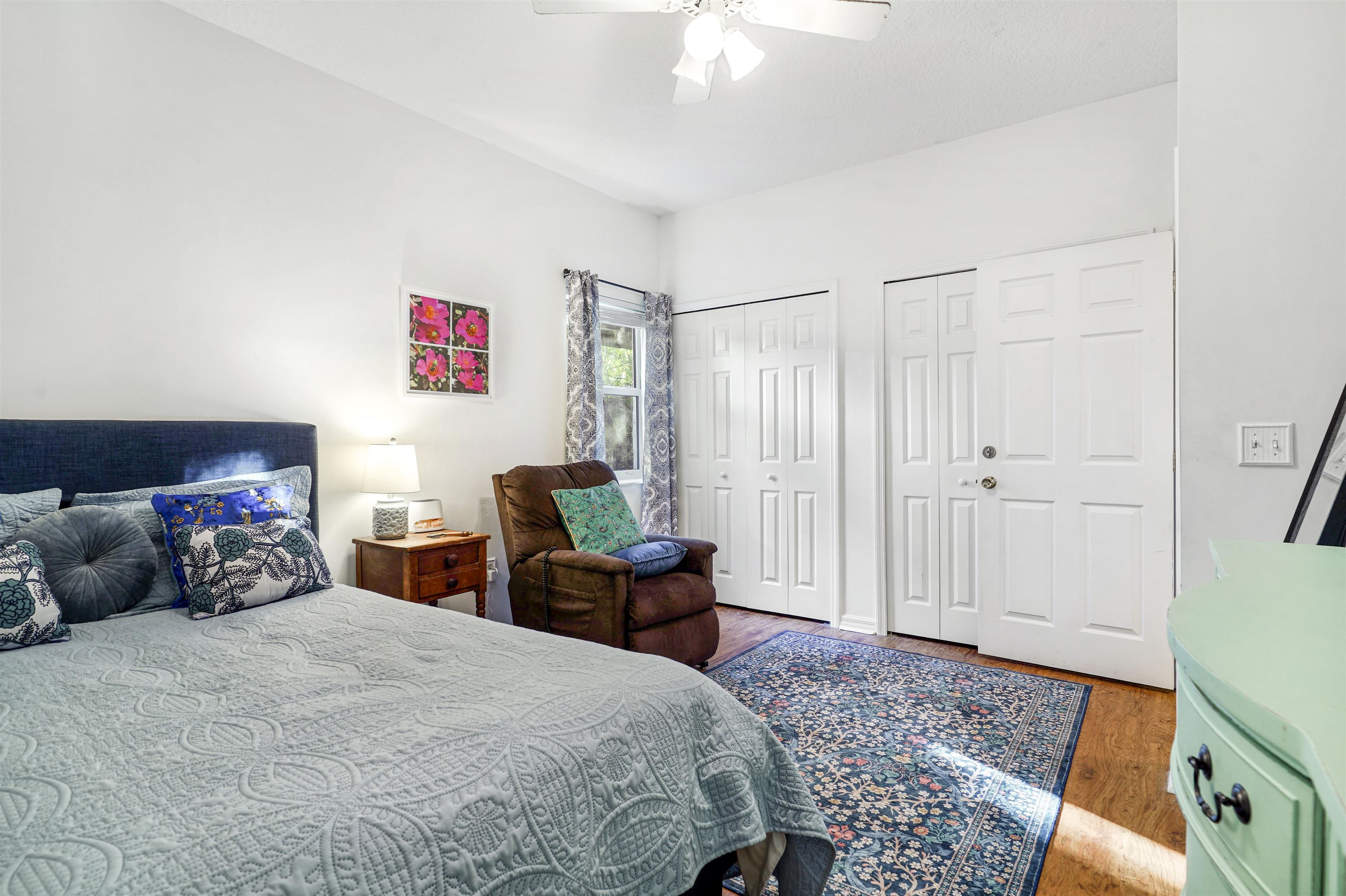 415 Fifteenth Street St. Augustine, FL 32084 - Photo 32 of 41 a bedroom with a bed and wooden floor