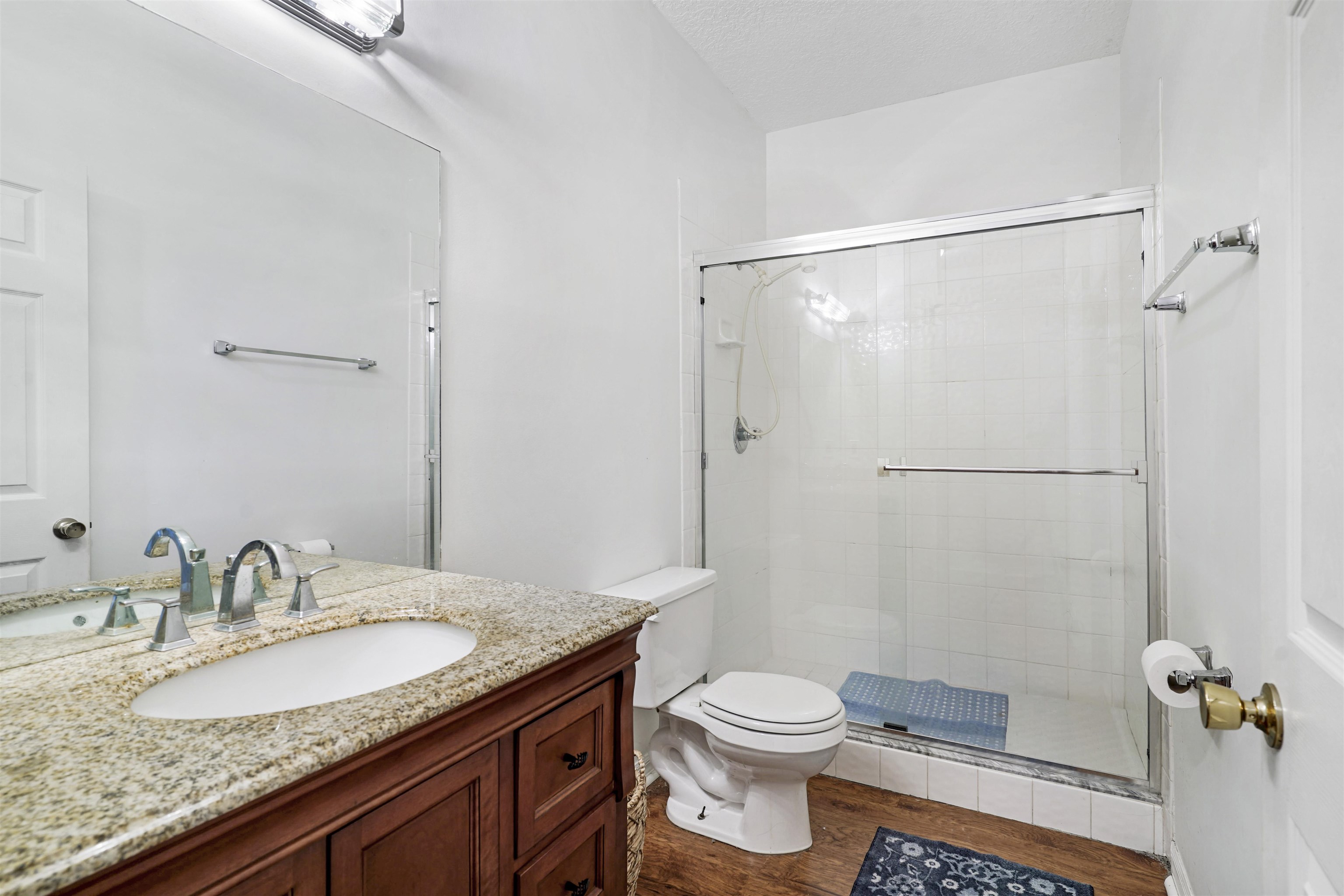 415 Fifteenth Street St. Augustine, FL 32084 - Photo 33 of 41 a bathroom with a granite countertop sink toilet and shower