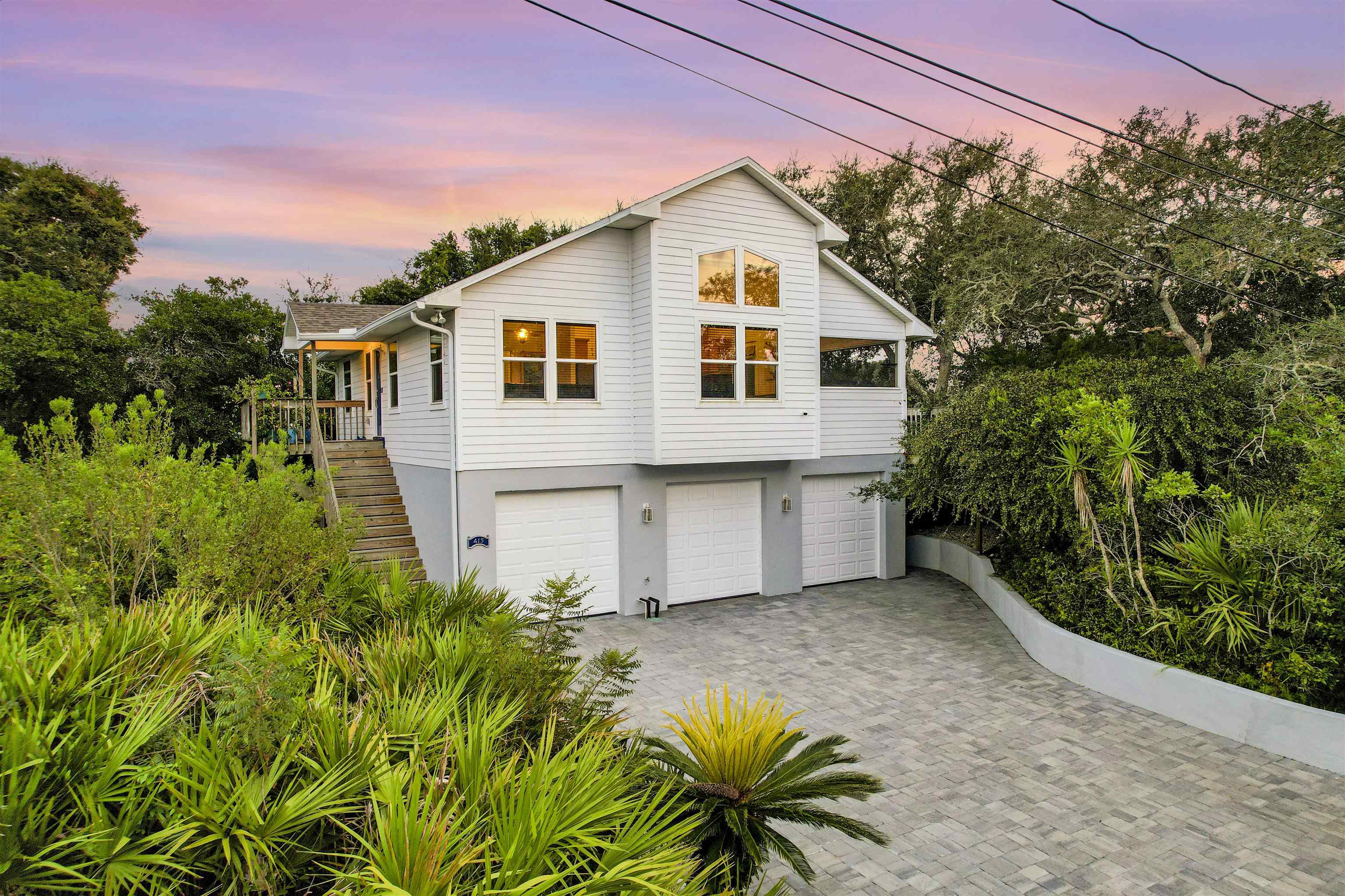 415 Fifteenth Street St. Augustine, FL 32084 - Photo 6 of 41 a front view of a house with a garden