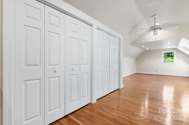 a view of an empty room and wooden floor