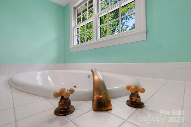 a bath tub sitting next to a window