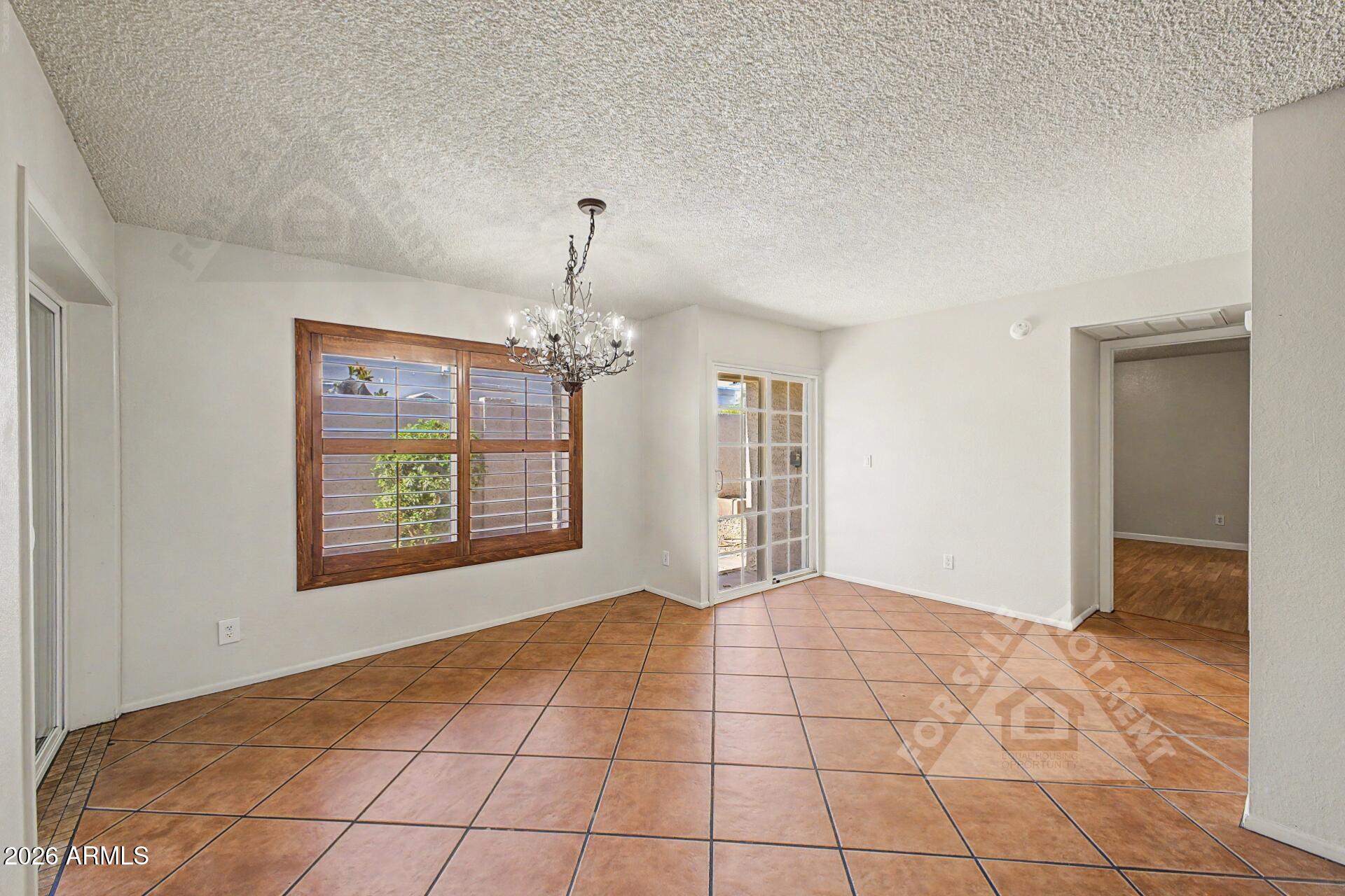 912 East Villa Rita Drive Phoenix, AZ 85022 - Photo 8 of 27 a view of an empty room with a window