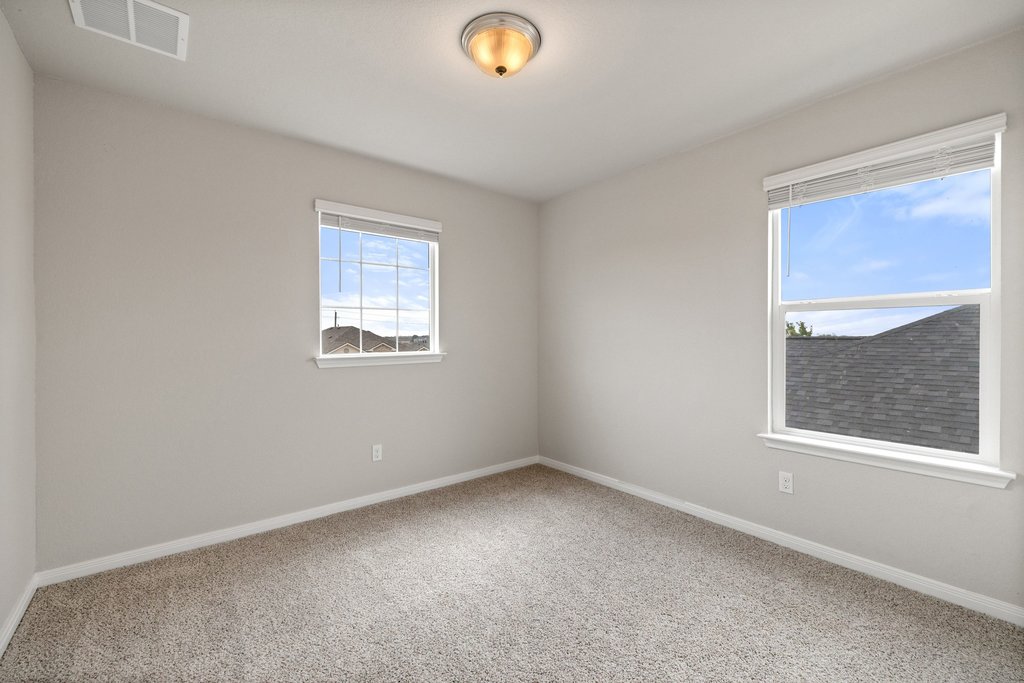102 Ashford Way Georgetown, TX 78626 - Photo 22 of 28 A well-lit room awaits your personal touch with ample natural light from multiple windows.