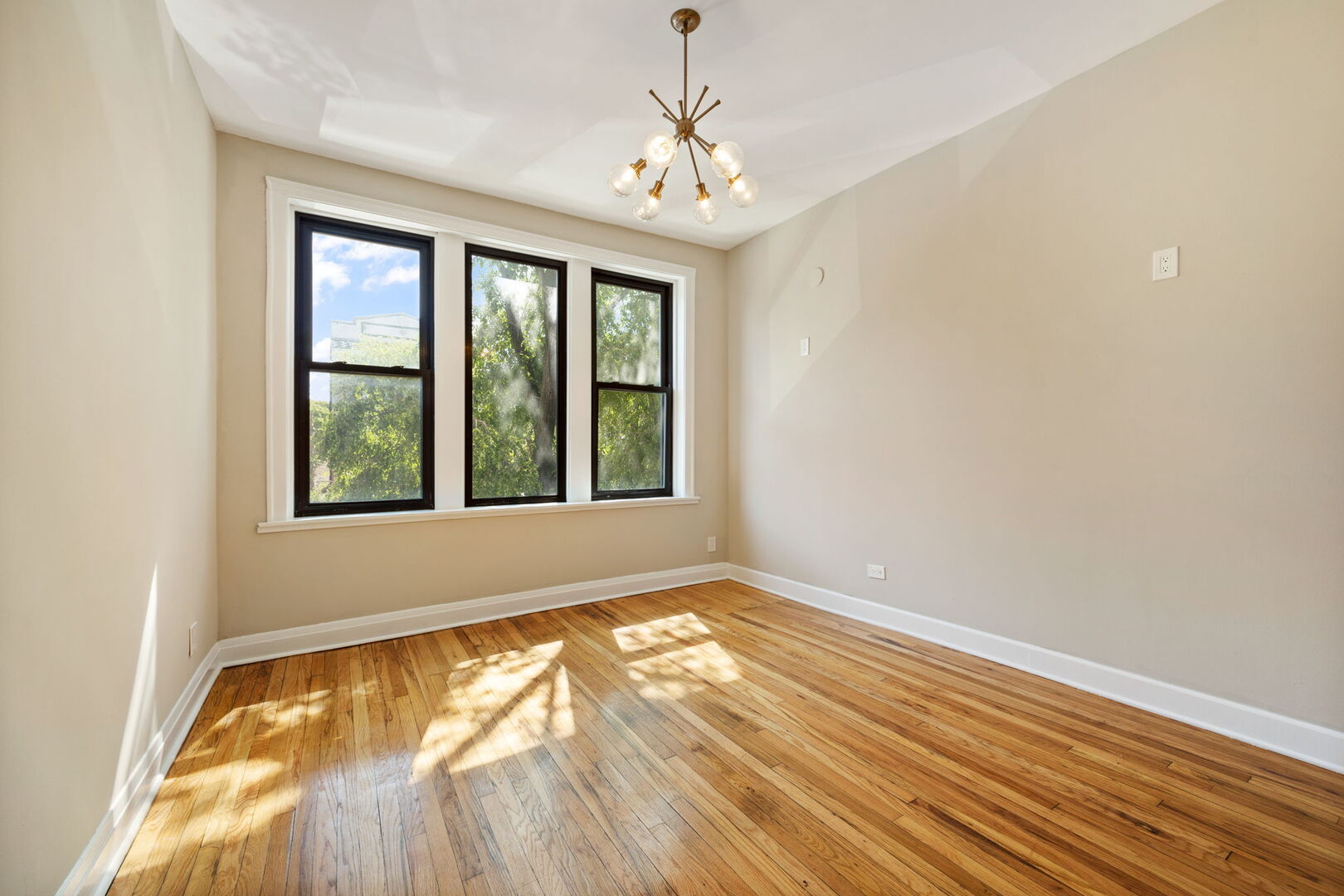2242 North Western Avenue, Unit 2F Chicago, IL 60647 - Photo 2 of 12 a view of an empty room with a window