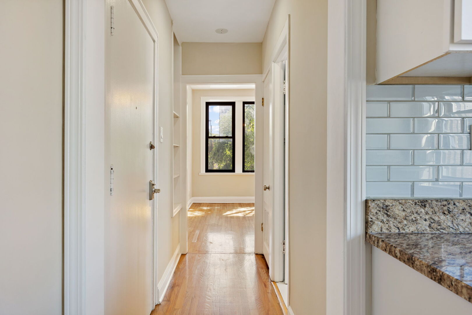 2242 North Western Avenue, Unit 2F Chicago, IL 60647 - Photo 4 of 12 a view of a bathroom from a hallway