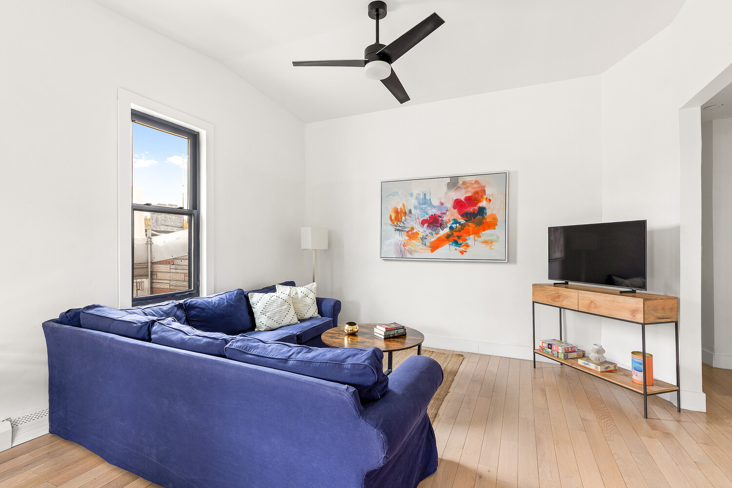 13 Reeve Place Brooklyn, NY 11218 - Photo 11 of 14 a living room with furniture and a flat screen tv