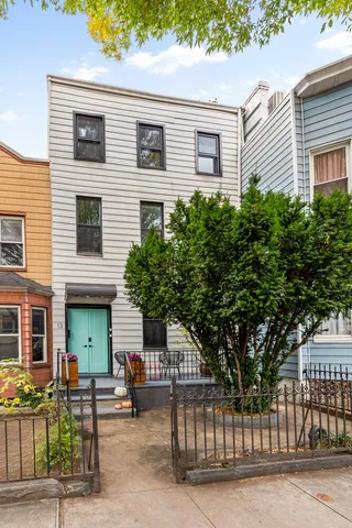 a bathroom with a sink a toilet a mirror and bathtub
