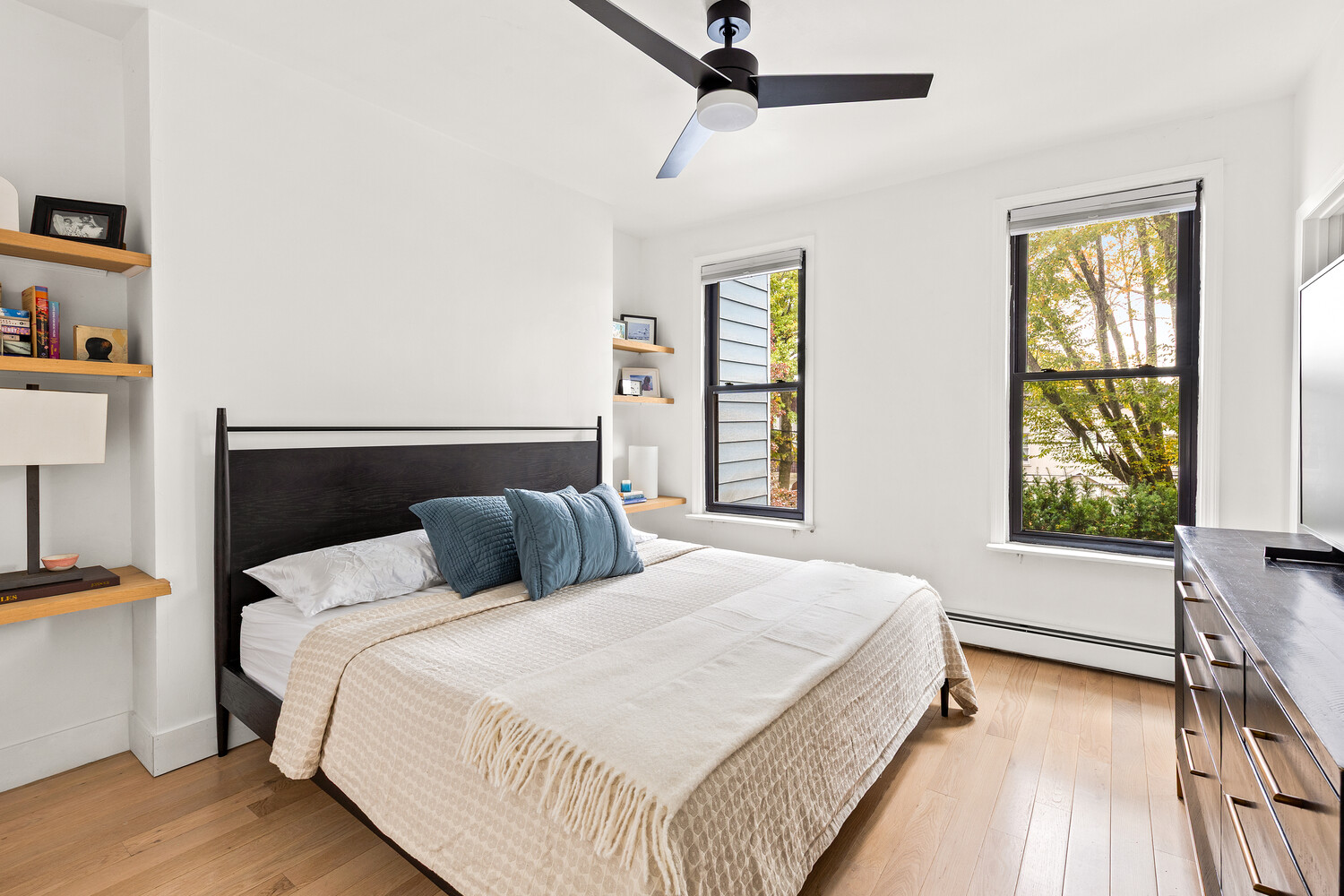 13 Reeve Place Brooklyn, NY 11218 - Photo 5 of 14 a bedroom with a bed and a window