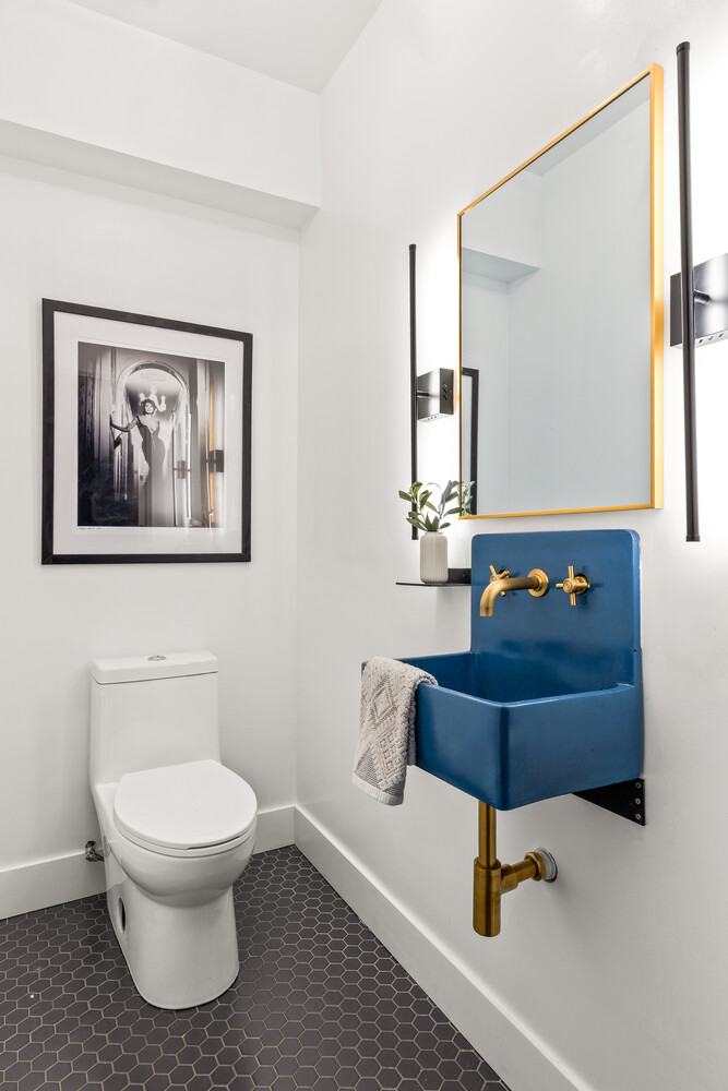 13 Reeve Place Brooklyn, NY 11218 - Photo 8 of 14 a bathroom with a toilet and a mirror