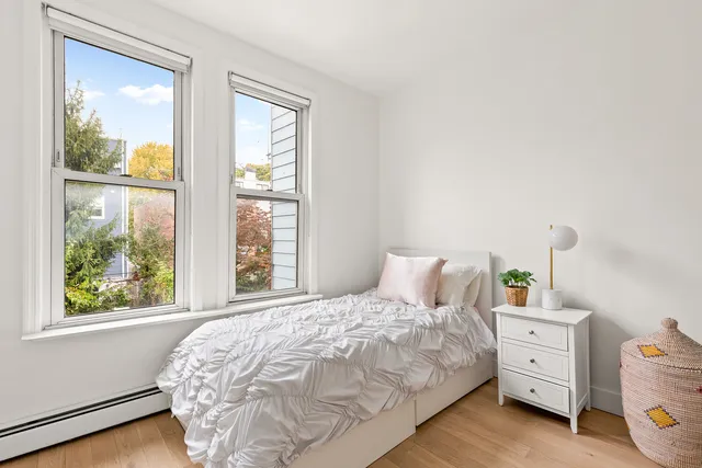 a bathroom with a toilet and a mirror