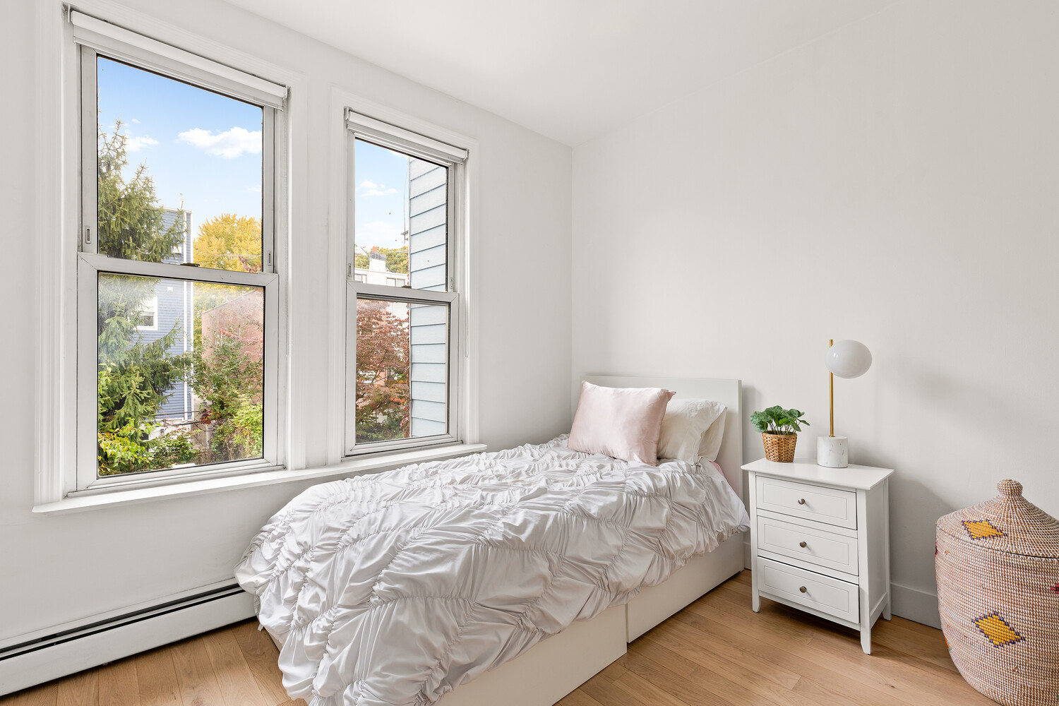 13 Reeve Place Brooklyn, NY 11218 - Photo 9 of 14 a bedroom with a bed and a window