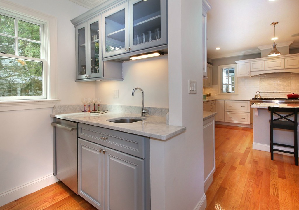 21 Cypress Road Wellesley, MA 02481 - Photo 7 of 23 a kitchen with stainless steel appliances granite countertop a sink a stove and a wooden floors