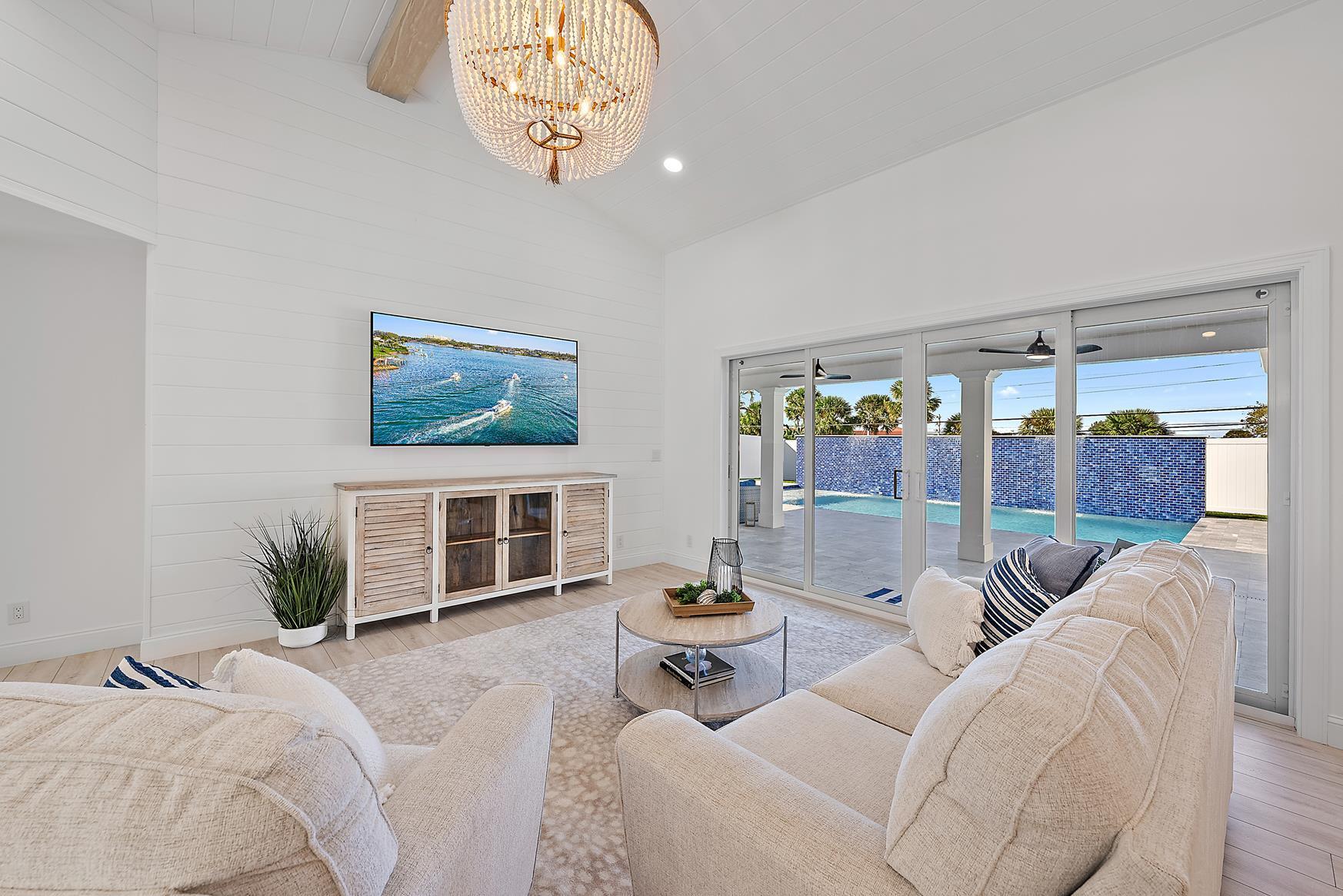 491 Sunset Way Juno Beach, FL 33408 - Photo 12 of 50 a bedroom with furniture and a large window