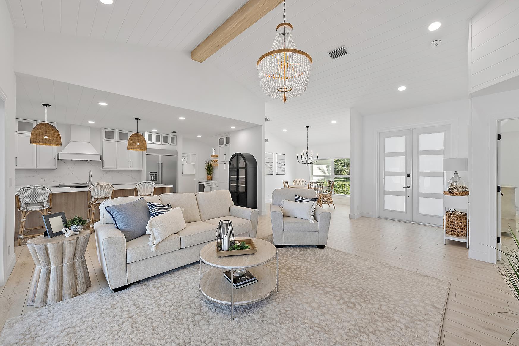 491 Sunset Way Juno Beach, FL 33408 - Photo 14 of 50 a living room with furniture and a large window