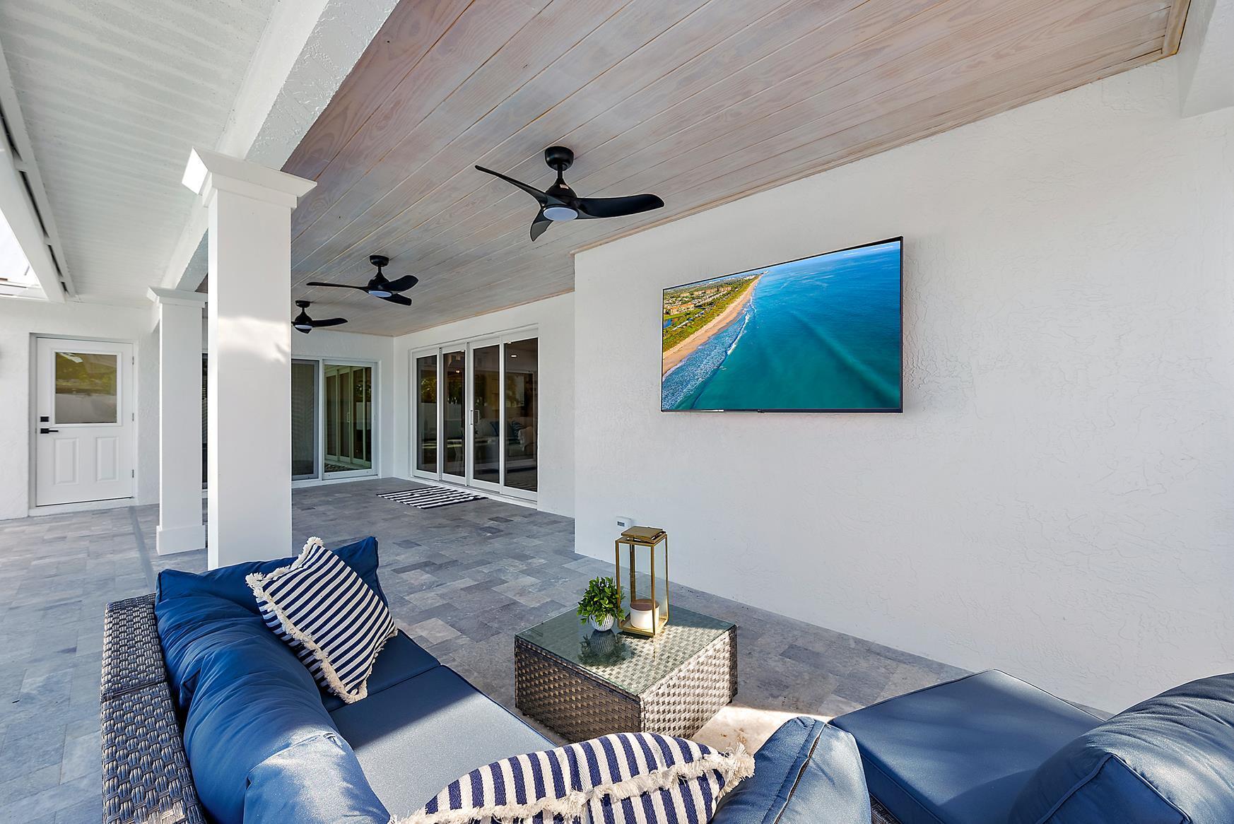 491 Sunset Way Juno Beach, FL 33408 - Photo 34 of 50 a living room with furniture and a window