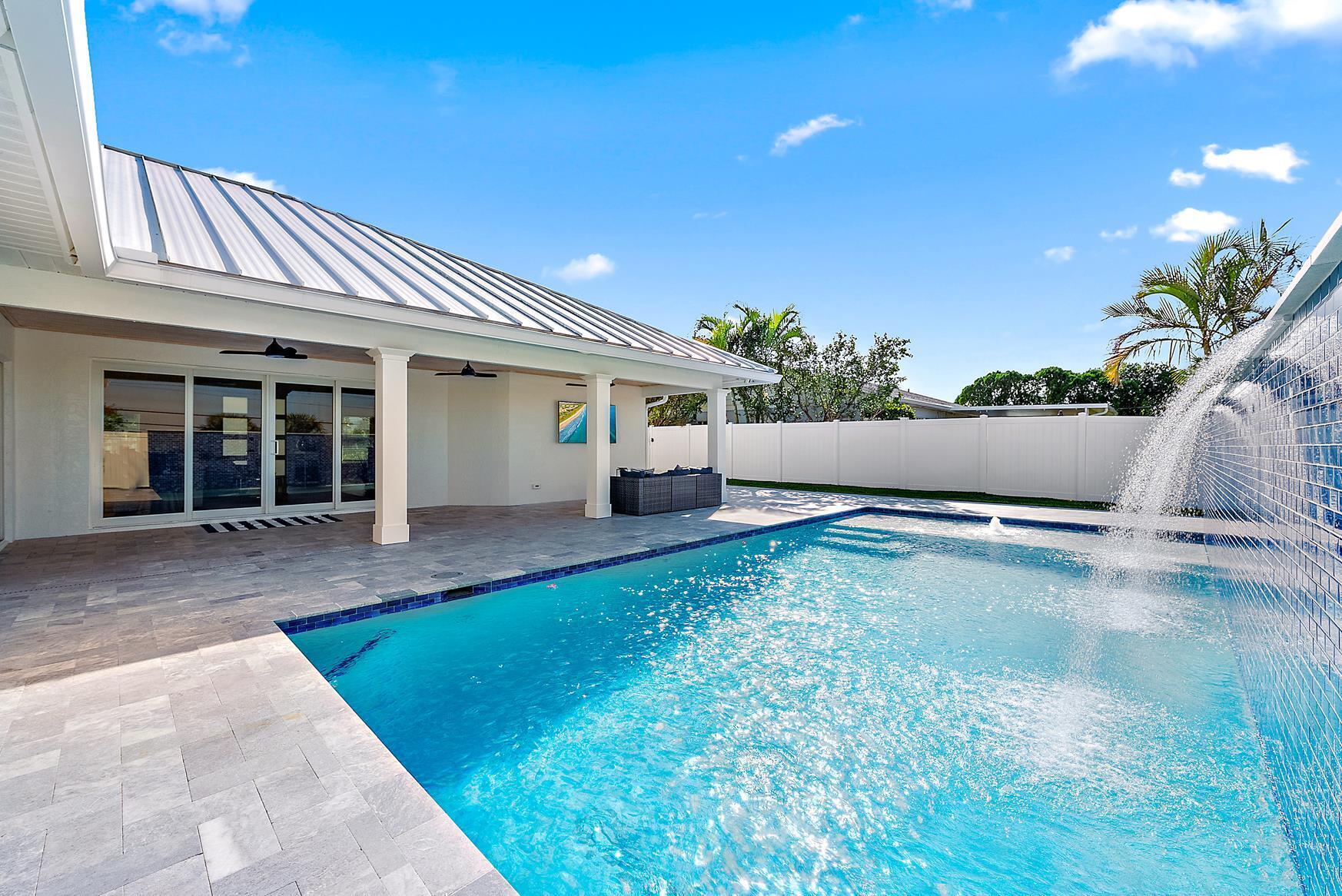 491 Sunset Way Juno Beach, FL 33408 - Photo 36 of 50 swimming pool view with a outdoor space