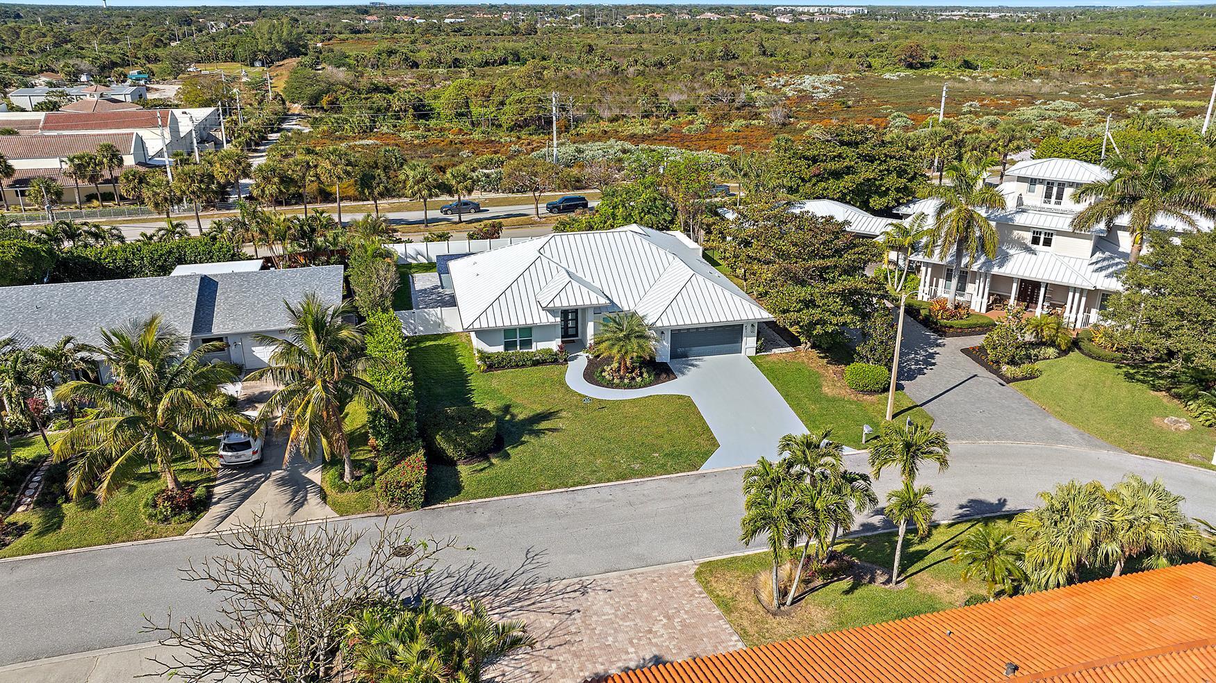 491 Sunset Way Juno Beach, FL 33408 - Photo 37 of 50 an aerial view of residential houses with outdoor space