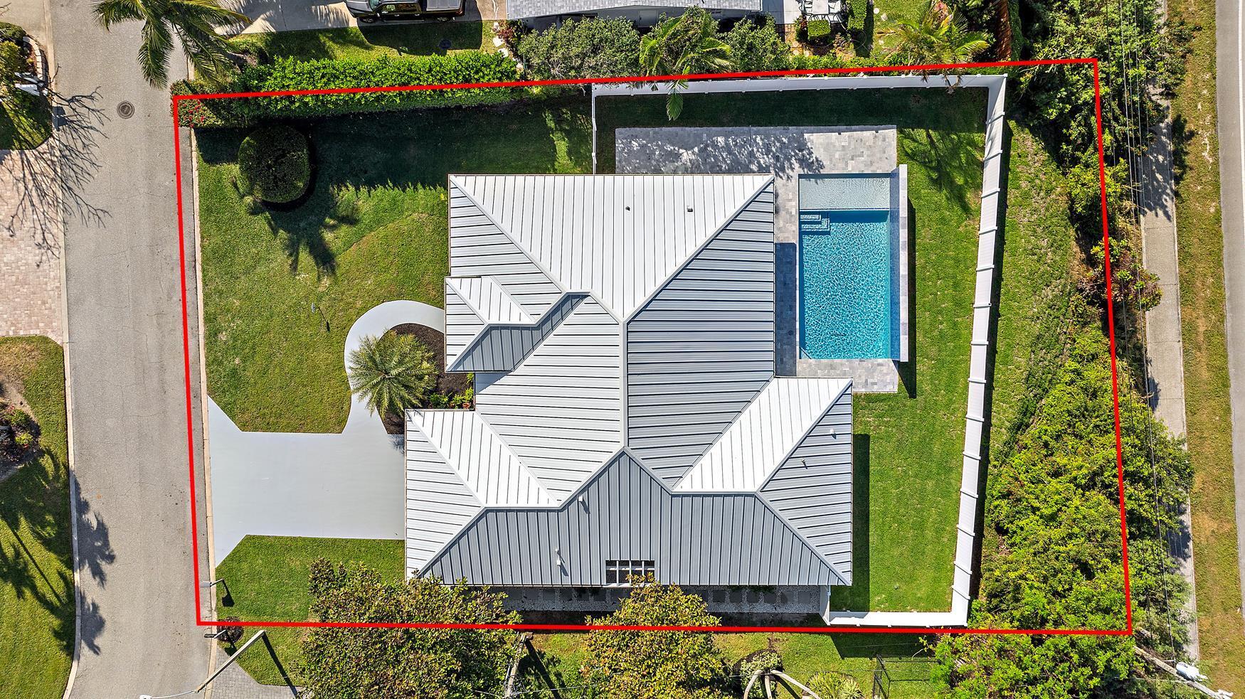 491 Sunset Way Juno Beach, FL 33408 - Photo 39 of 50 an aerial view of a house with garden space and plants