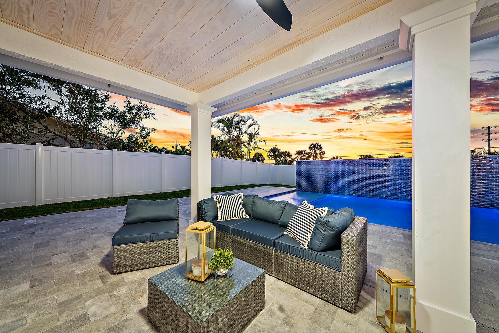 491 Sunset Way Juno Beach, FL 33408 - Photo 6 of 50 a living room with furniture and a large window