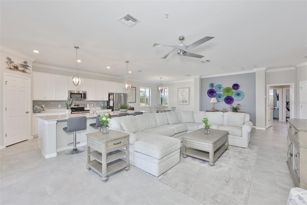 12405 Ghiberti Circle, Unit 202 Venice, FL 34293 - Photo 12 of 35 a living room with furniture and a view of kitchen