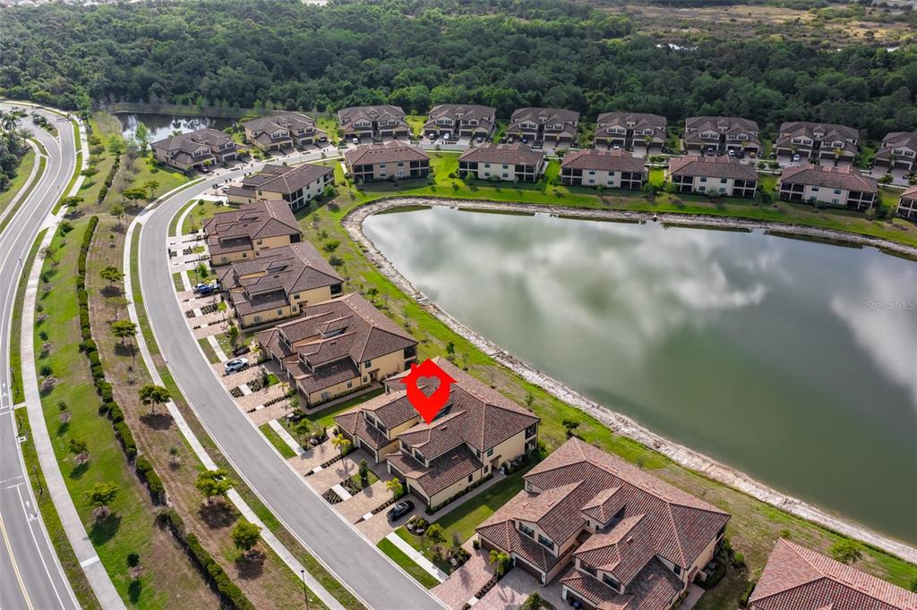 12405 Ghiberti Circle, Unit 202 Venice, FL 34293 - Photo 35 of 35 an aerial view of a swimming pool with outdoor seating