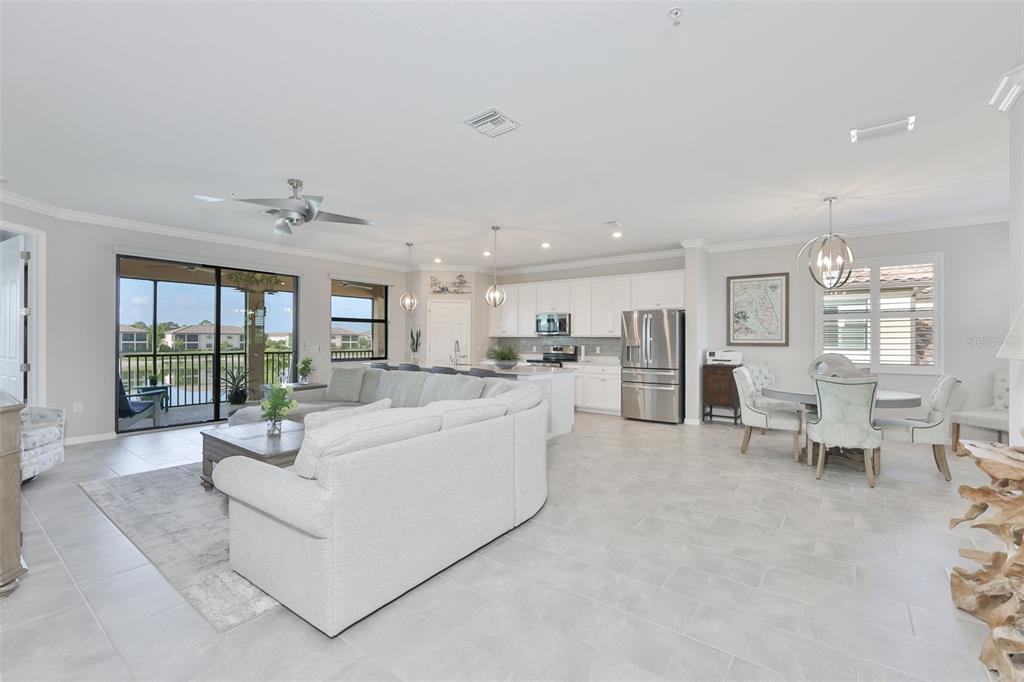 12405 Ghiberti Circle, Unit 202 Venice, FL 34293 - Photo 9 of 35 a living room with furniture and a table