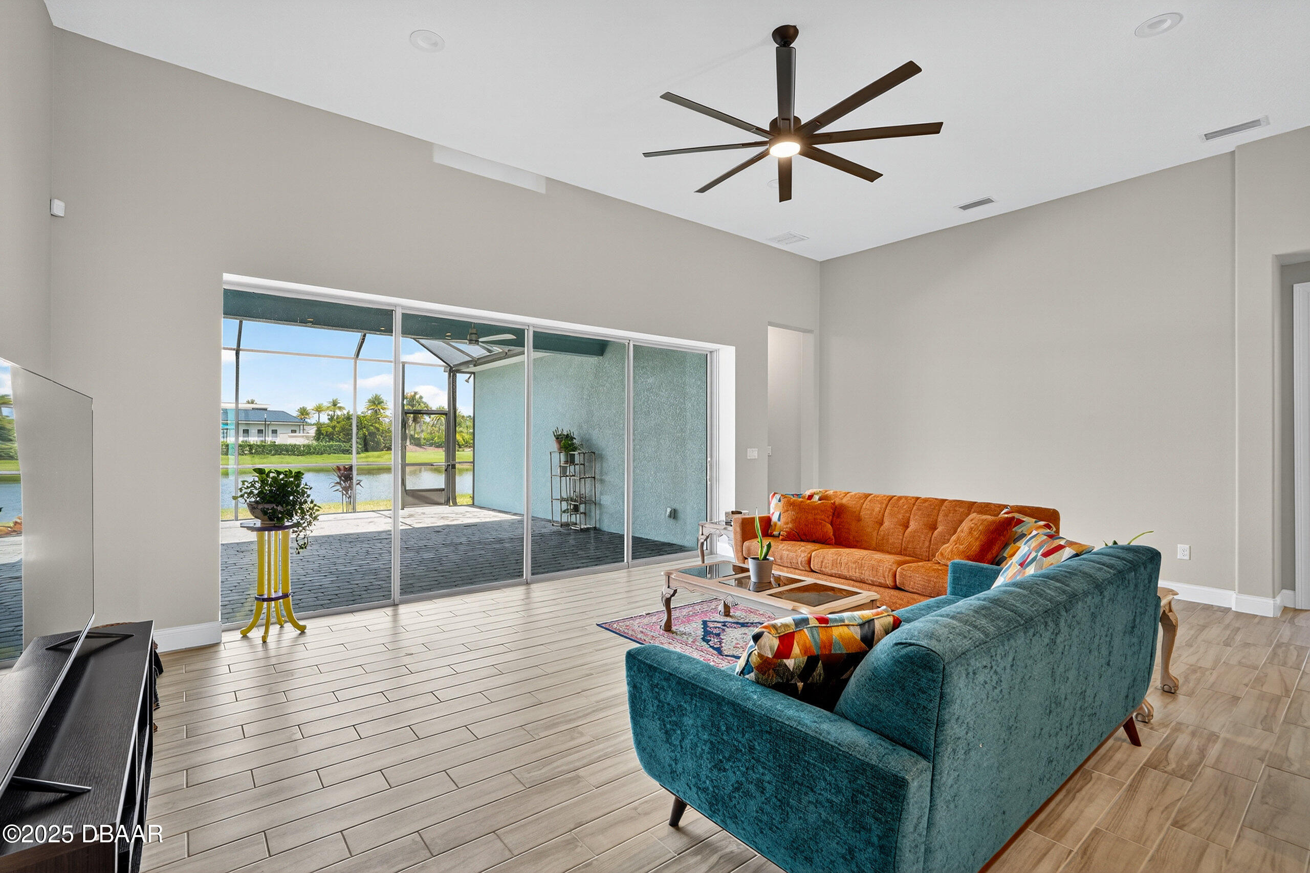 212 Fuchsia Street Daytona Beach, FL 32124 - Photo 11 of 54 a living room with furniture and a large window