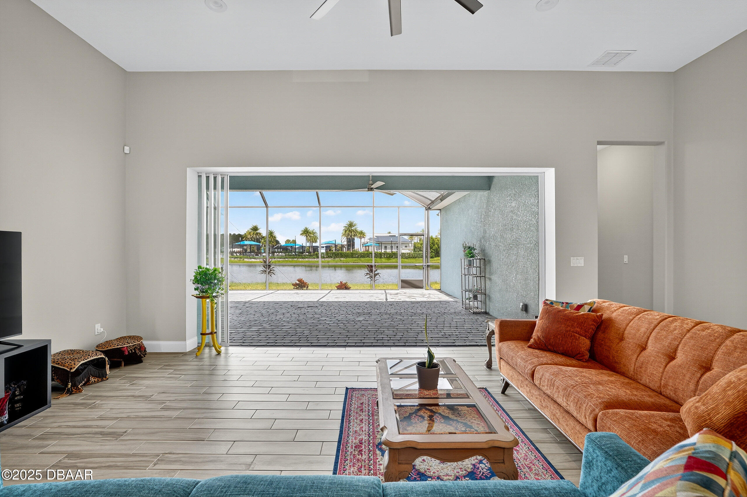 212 Fuchsia Street Daytona Beach, FL 32124 - Photo 13 of 54 a living room with furniture and a large window
