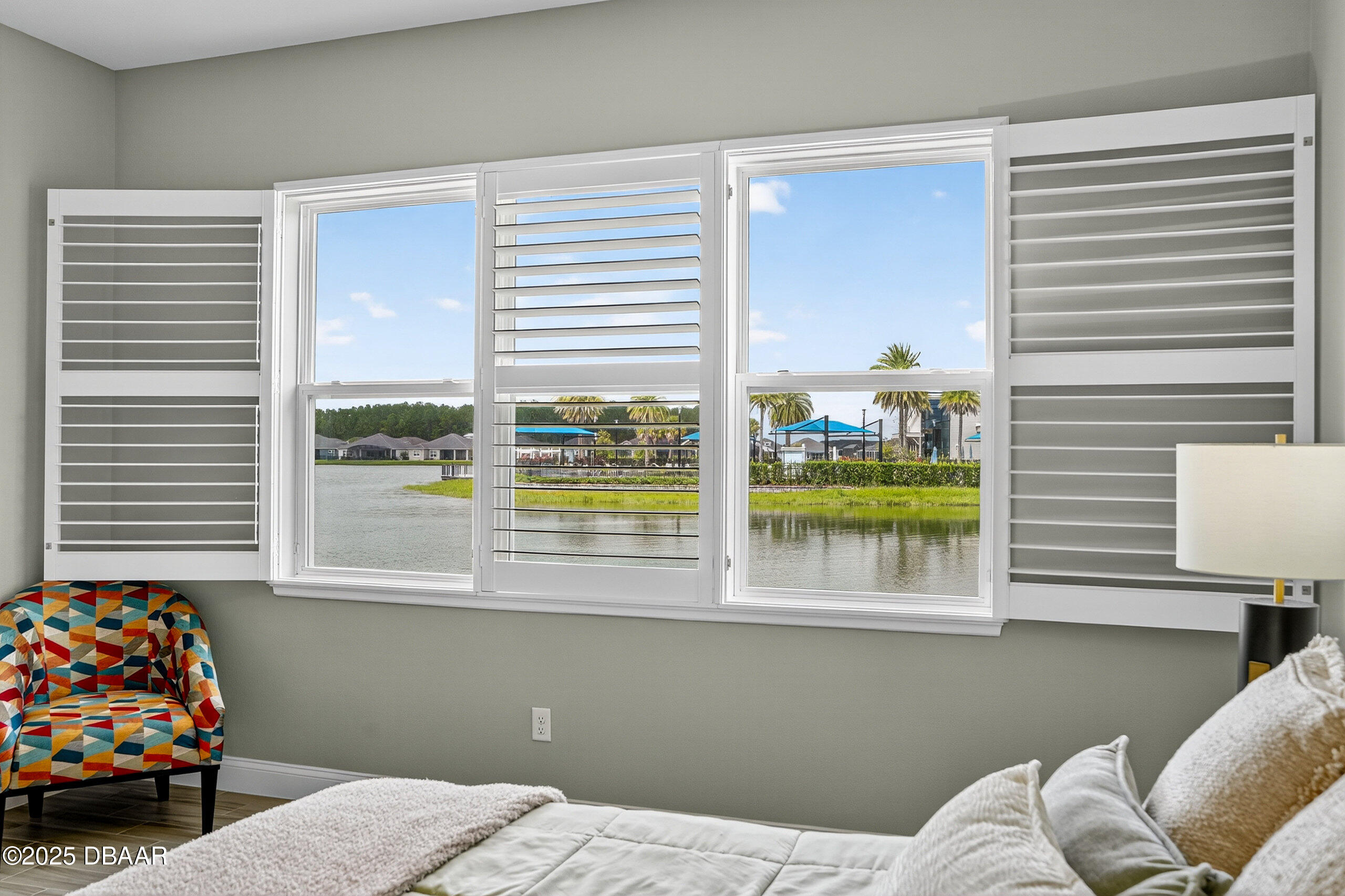 212 Fuchsia Street Daytona Beach, FL 32124 - Photo 21 of 54 a bedroom with a bed and a window