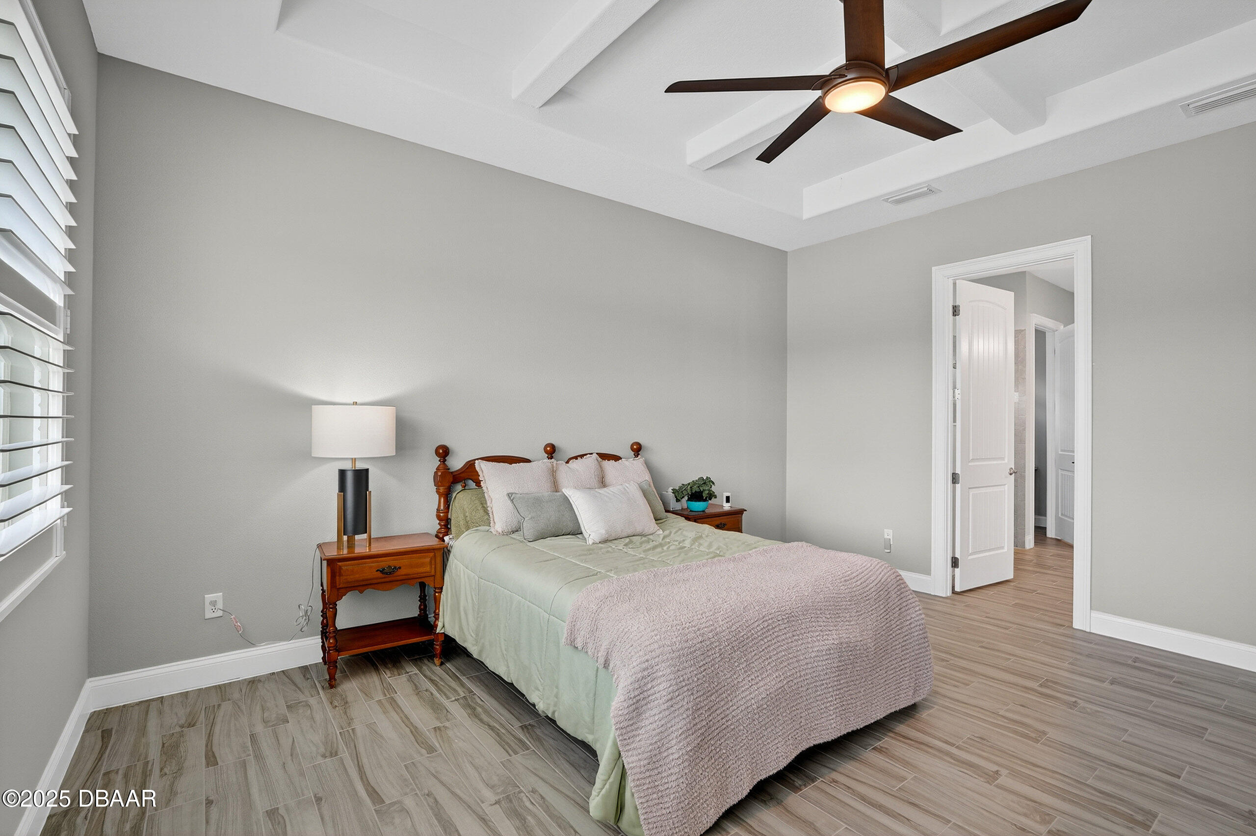 212 Fuchsia Street Daytona Beach, FL 32124 - Photo 22 of 54 a bedroom with a bed and wooden floor