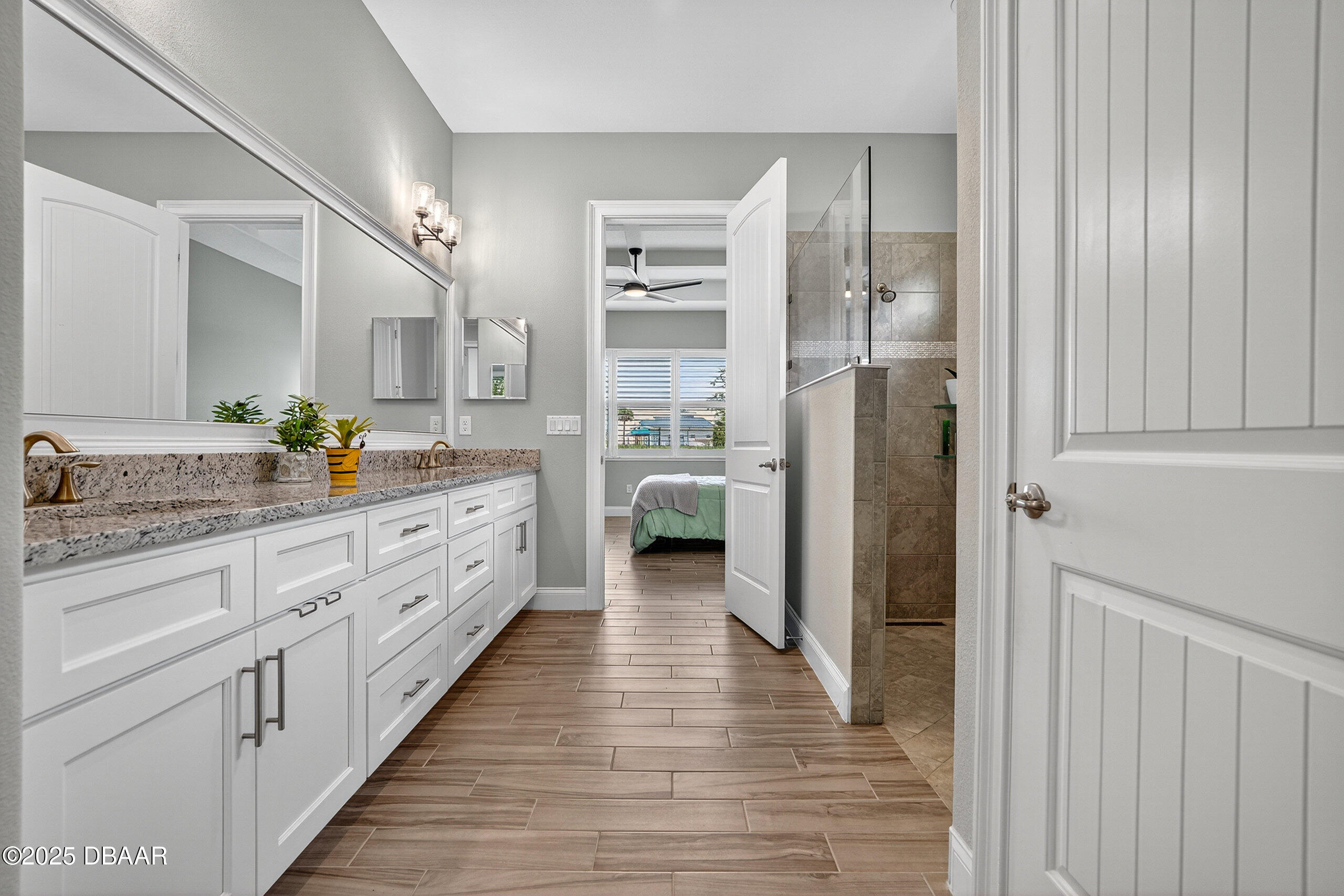212 Fuchsia Street Daytona Beach, FL 32124 - Photo 25 of 54 a bathroom with a double vanity sink and a mirror