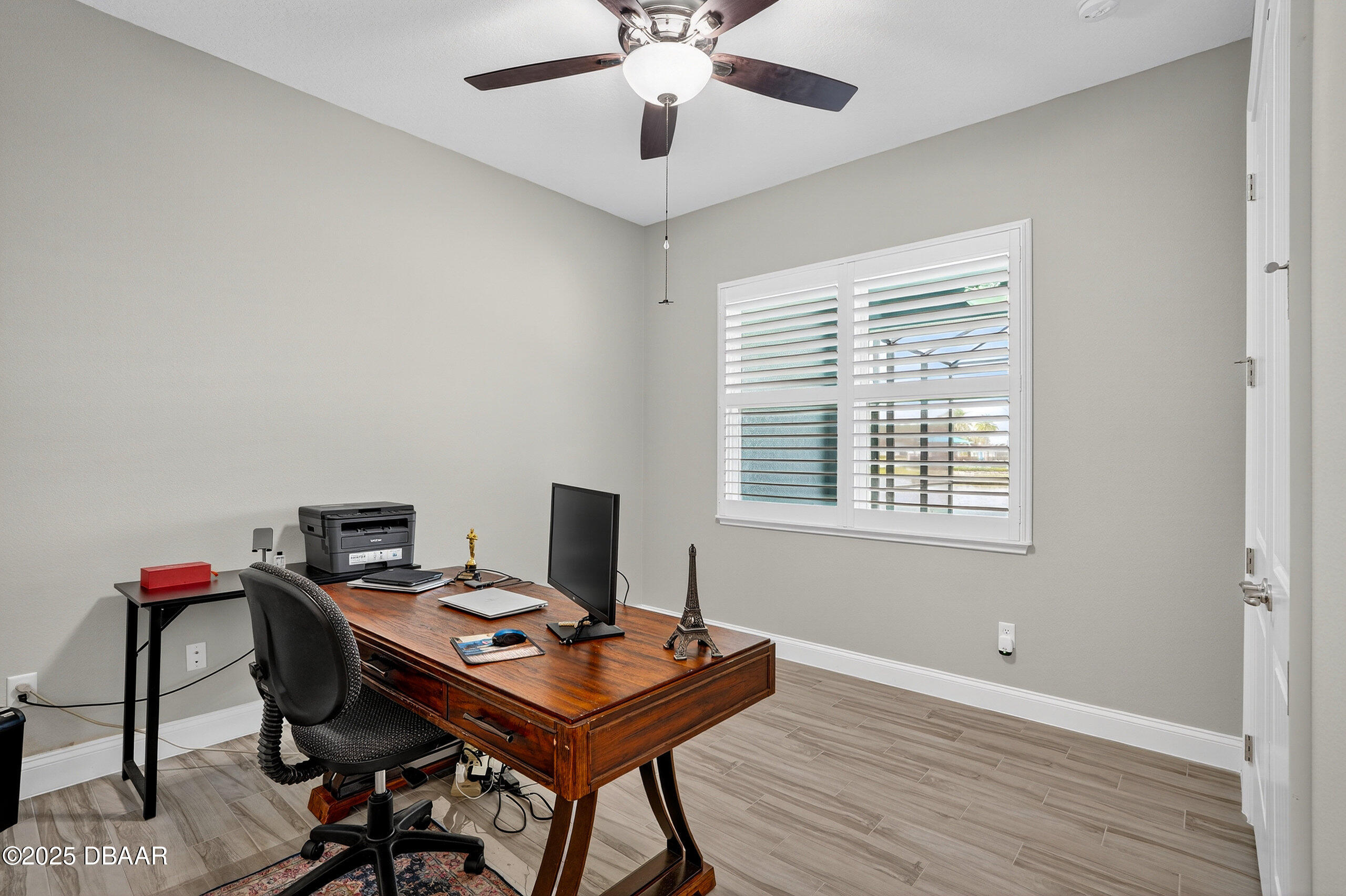 212 Fuchsia Street Daytona Beach, FL 32124 - Photo 35 of 54 a view of a workspace with furniture and a window