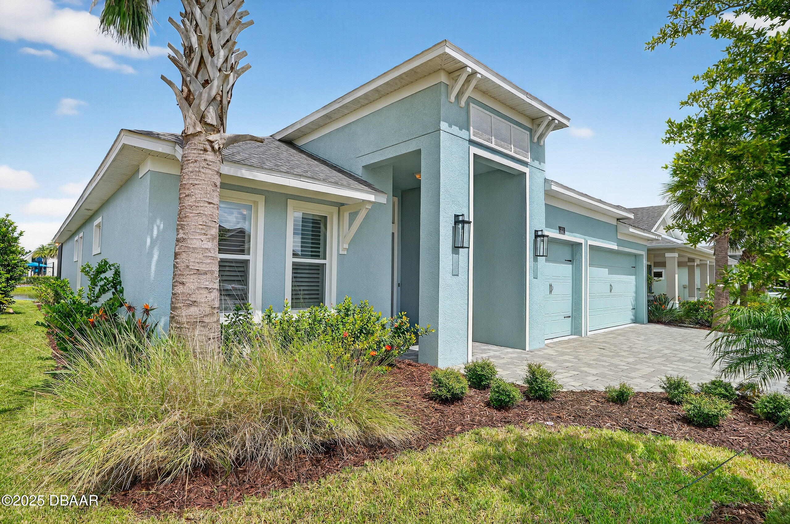 212 Fuchsia Street Daytona Beach, FL 32124 - Photo 38 of 54 a front view of a house with garden