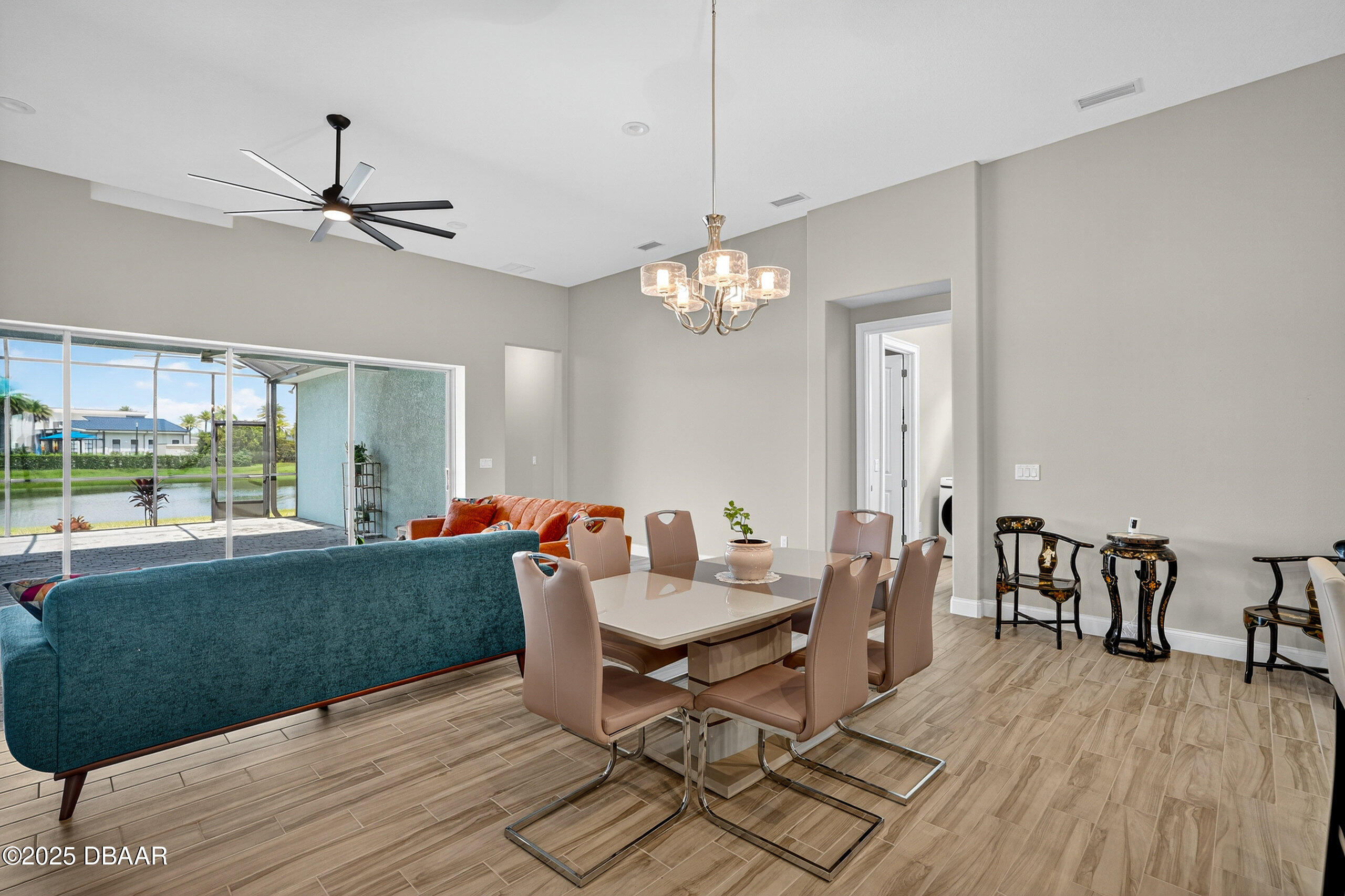 212 Fuchsia Street Daytona Beach, FL 32124 - Photo 10 of 54 a view of a dining room with furniture window and wooden floor