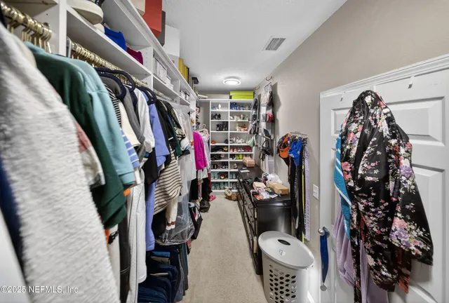 a view of a closet with storage