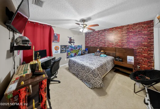 a bedroom with bed and a fireplace