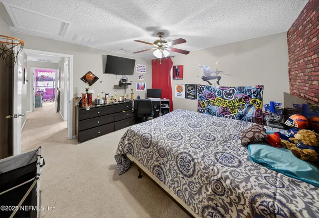 a bathroom with a double vanity sink a toilet and shower