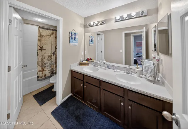 a bedroom with furniture and a fireplace