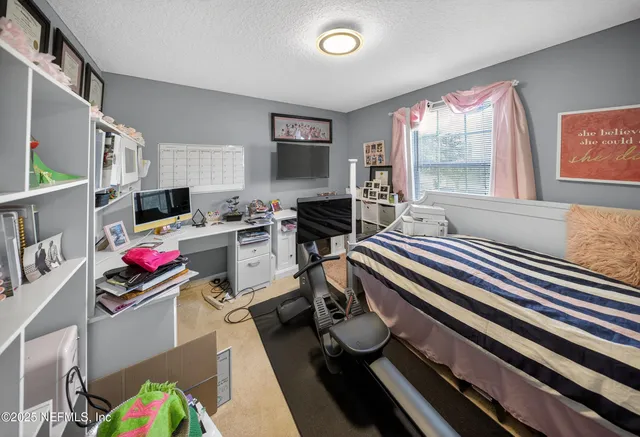 a view of a balcony with table and chairs