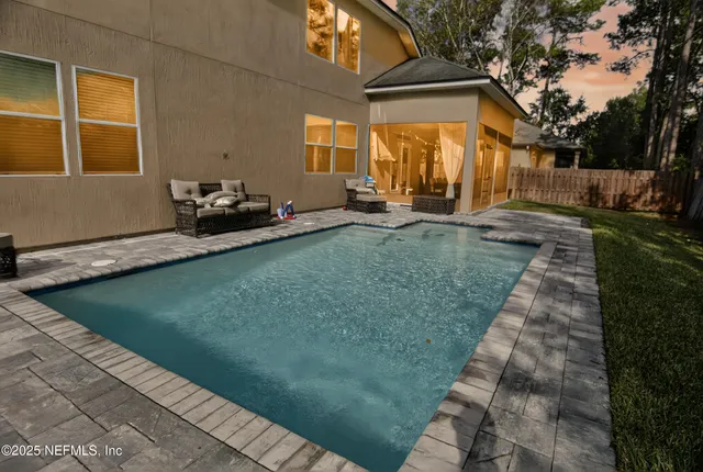 a picture of a bathroom with a sink and mirror